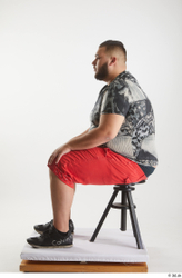 Whole Body Man White Casual Shirt Shorts Overweight Sitting Studio photo references